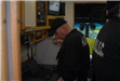Police officers working in a command truck.