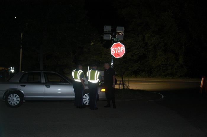 Police officers standing and talking to one another.