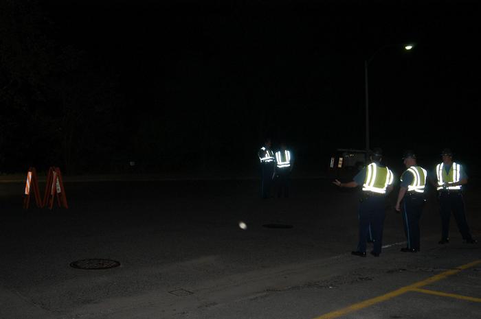 Police officers standing and talking to one another.