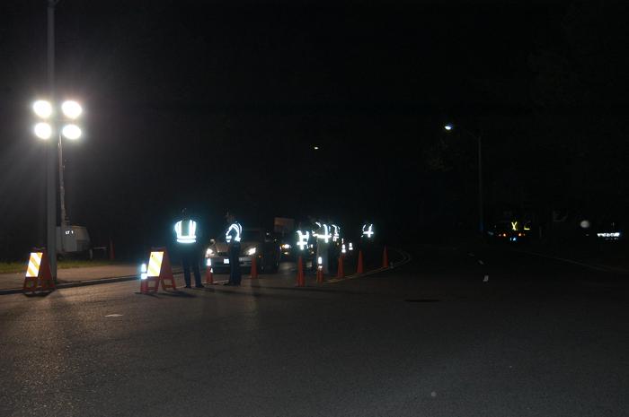 Police officers conducting a traffic stop.