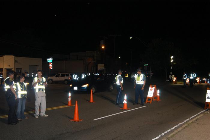 Police officers conducting a traffic stop.
