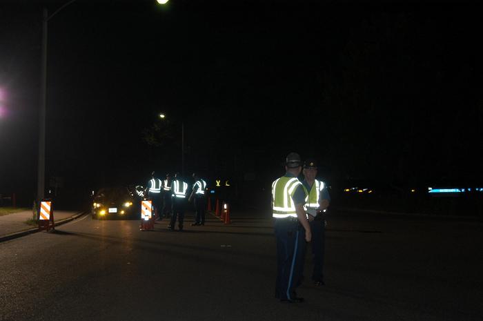 Police officers conducting a traffic stop.