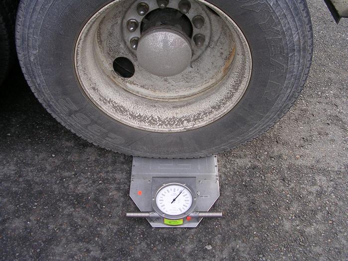 Truck Tires Being Measured