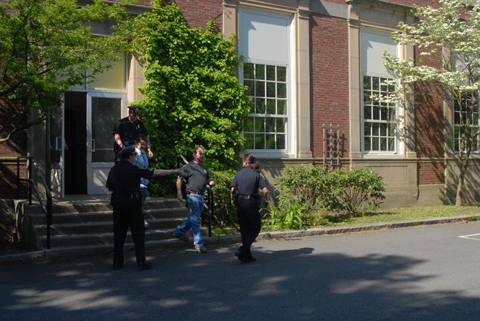 Citizens being evacuated from a building.