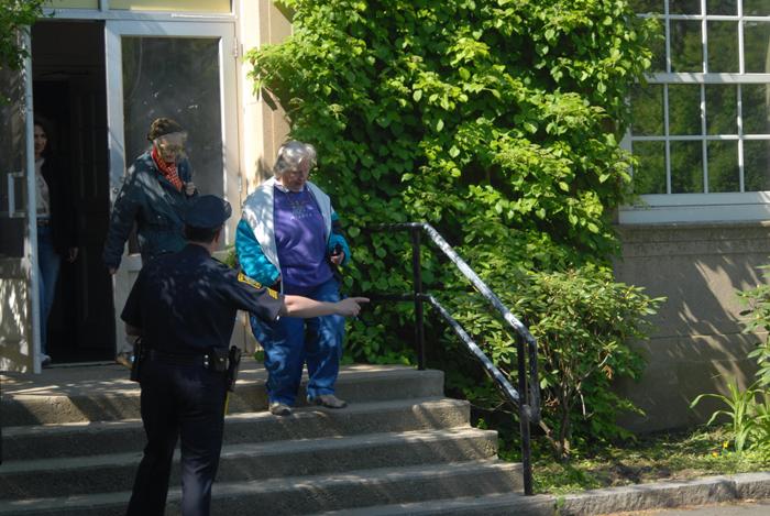 Citizens being evacuated from a building.