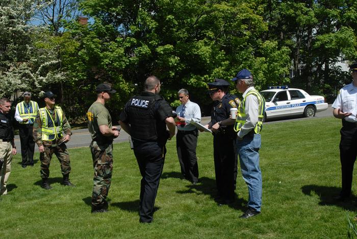 Police officers standing together talking.