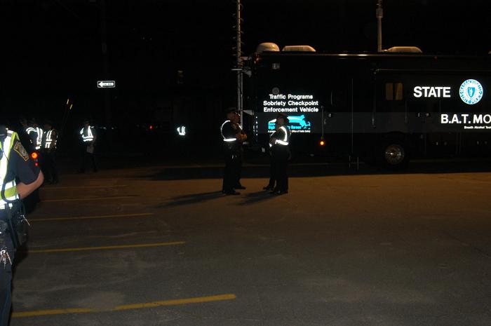 Police officers standing and talking to one another.